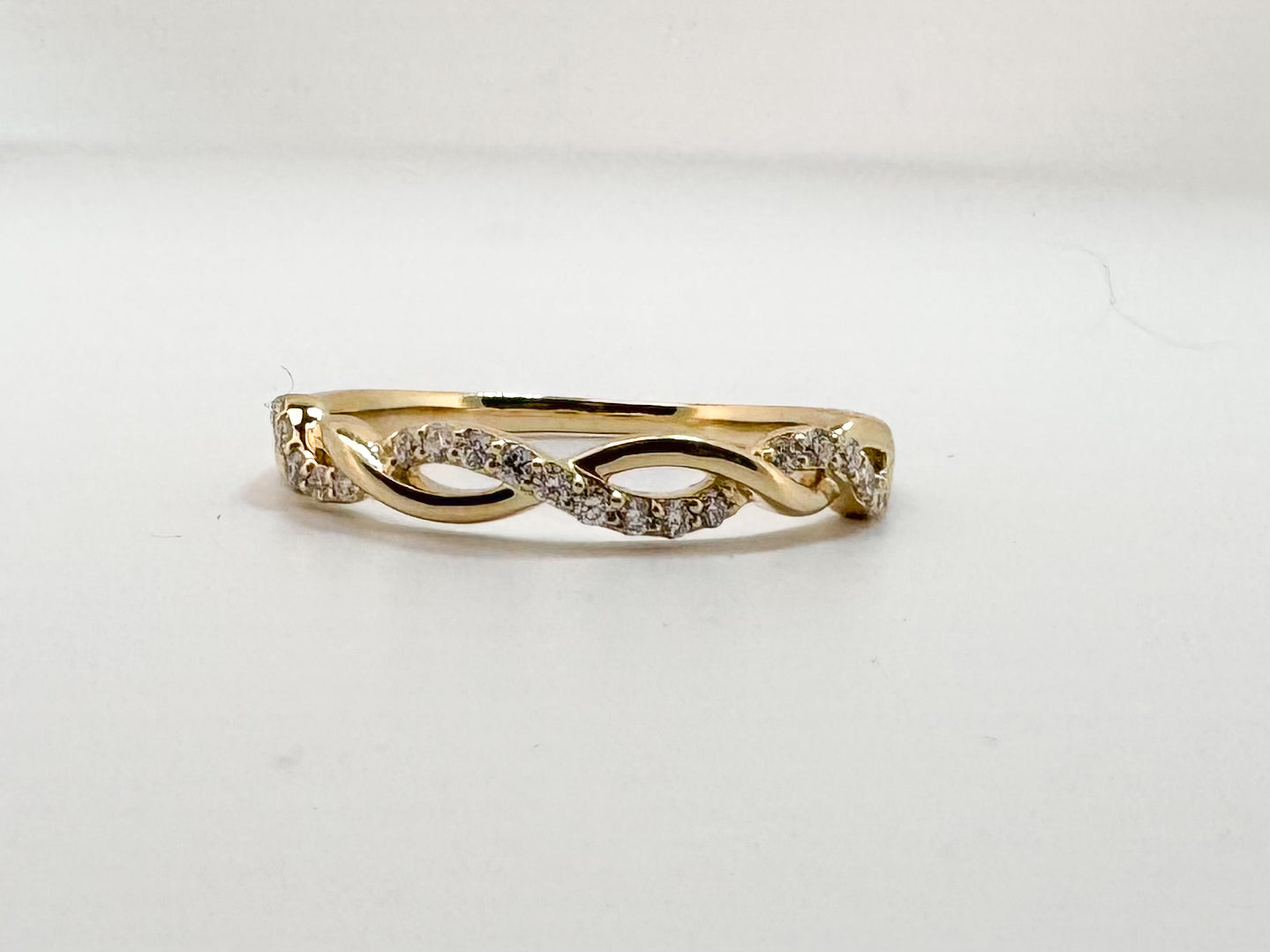 14K, Yellow gold, .14 diamond total weight, twisted wedding band.