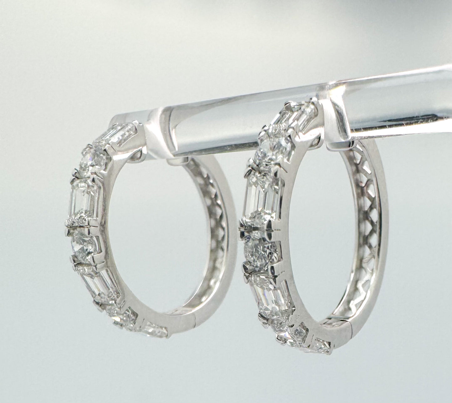 14K, White gold, 3.64 carat total weight, lab grown emerald cut and round brilliant diamond hoop earrings.