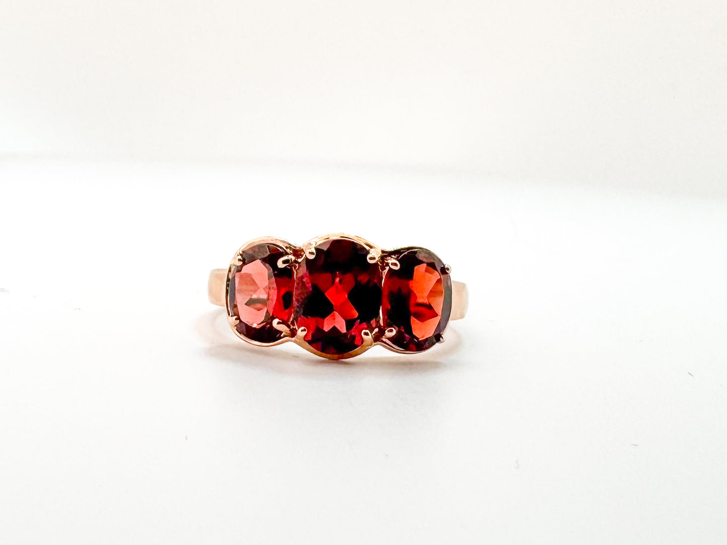 14K, Rose gold, three stone garnet ring. 3.25 carats