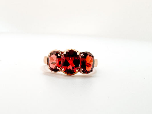 14K, Rose gold, three stone garnet ring. 3.25 carats