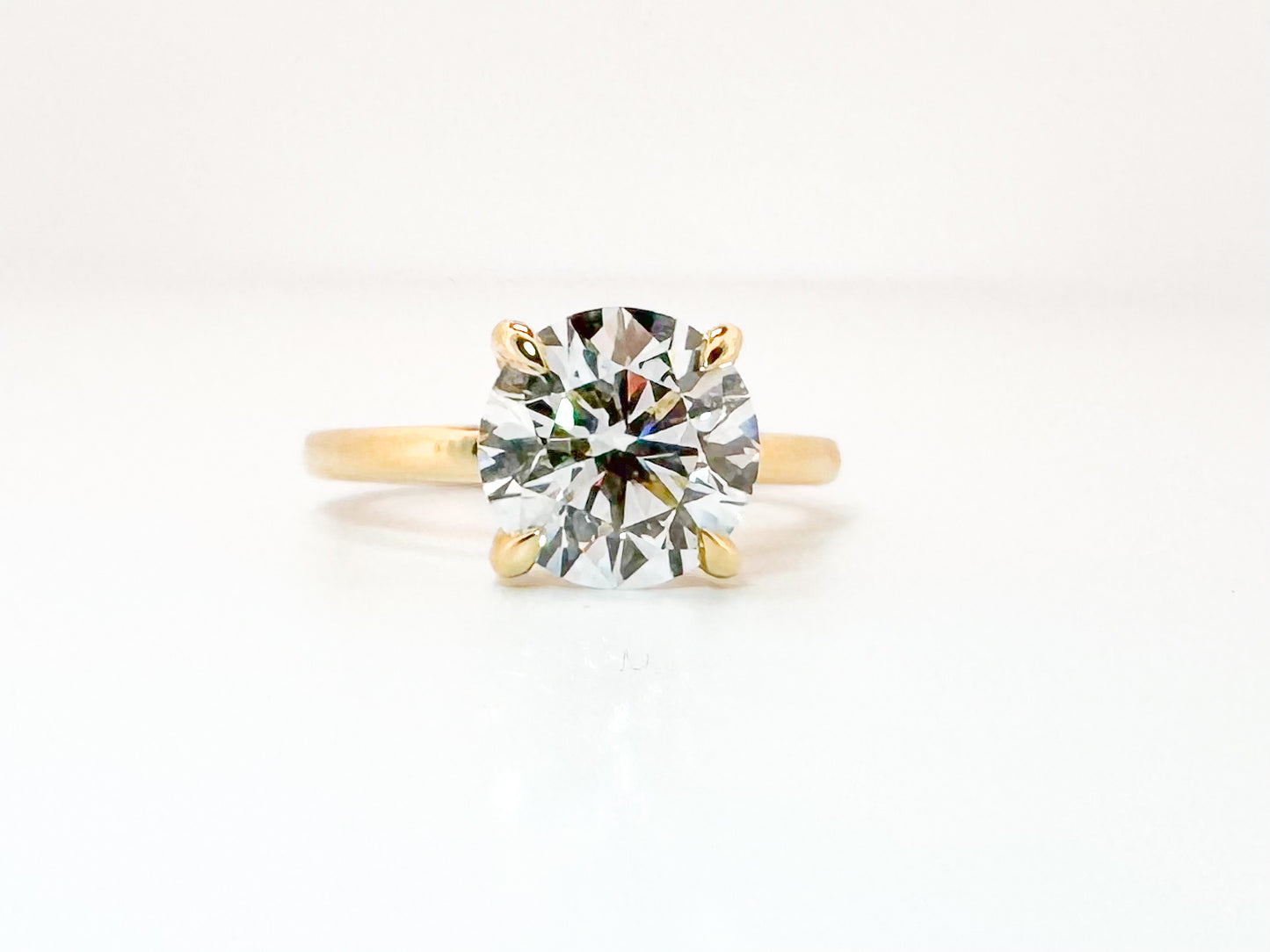 14K, Yellow gold 3.02 carat VS1 E ideal cut, lab grown set with .09 carat hidden halo, IGI certified