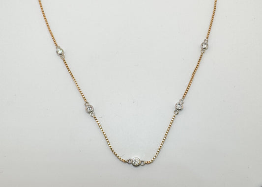 14k, two tone, .50 carat total weight, micro bezel diamond necklace.