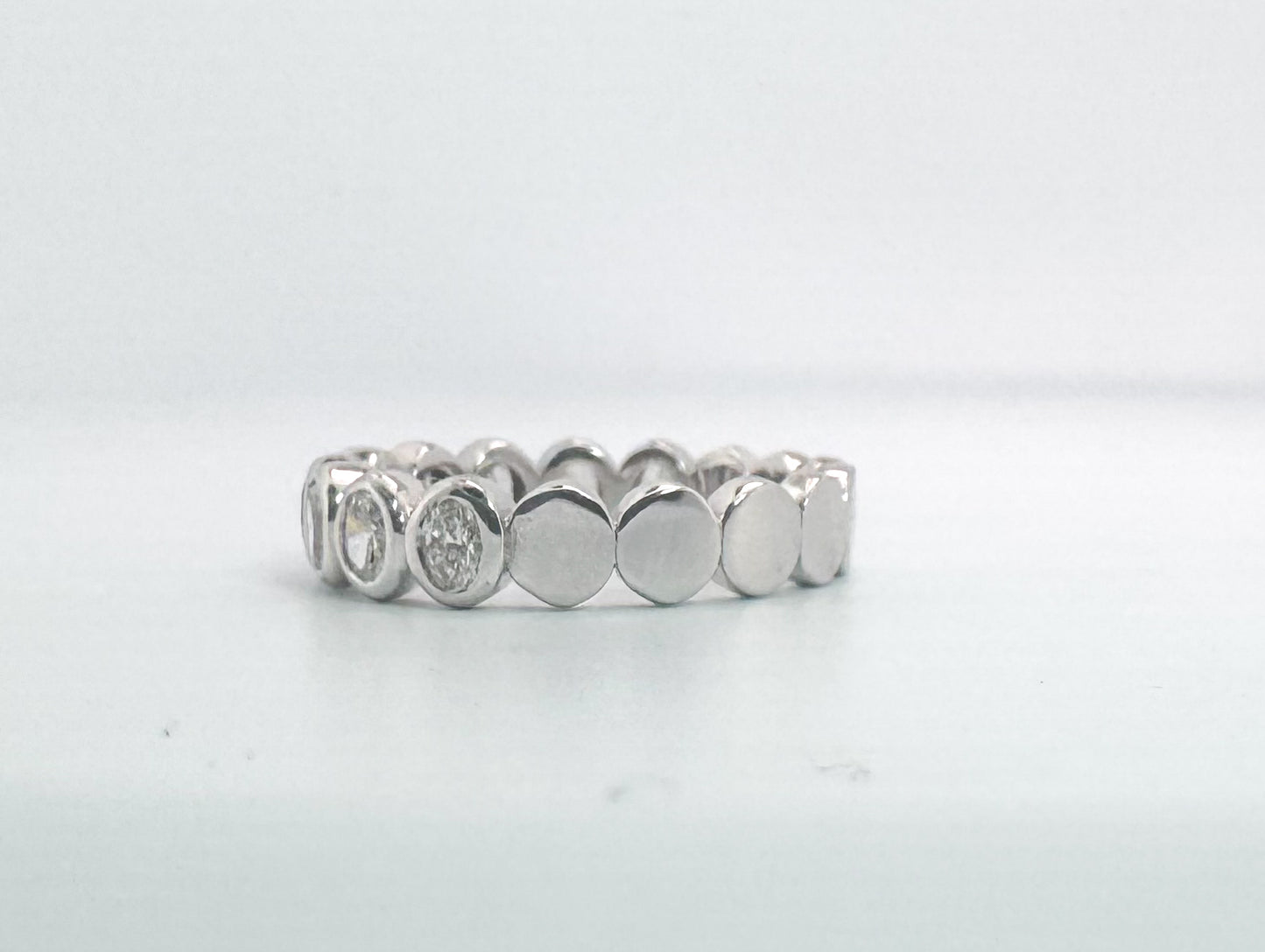 14k, white gold, natural oval diamond band. .97 carats