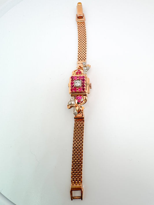 14k, rose gold "Elida" flip watch with .40 side diamond and 1.20 natural ruby.