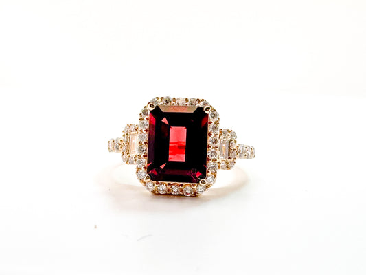 14K, Yellow gold, 2.50 carat garnet set with .50 side diamonds. Fashion ring