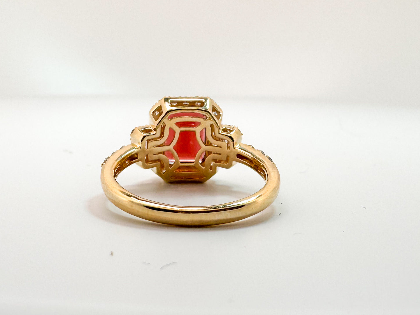 14K, Yellow gold, 2.50 carat garnet set with .50 side diamonds. Fashion ring