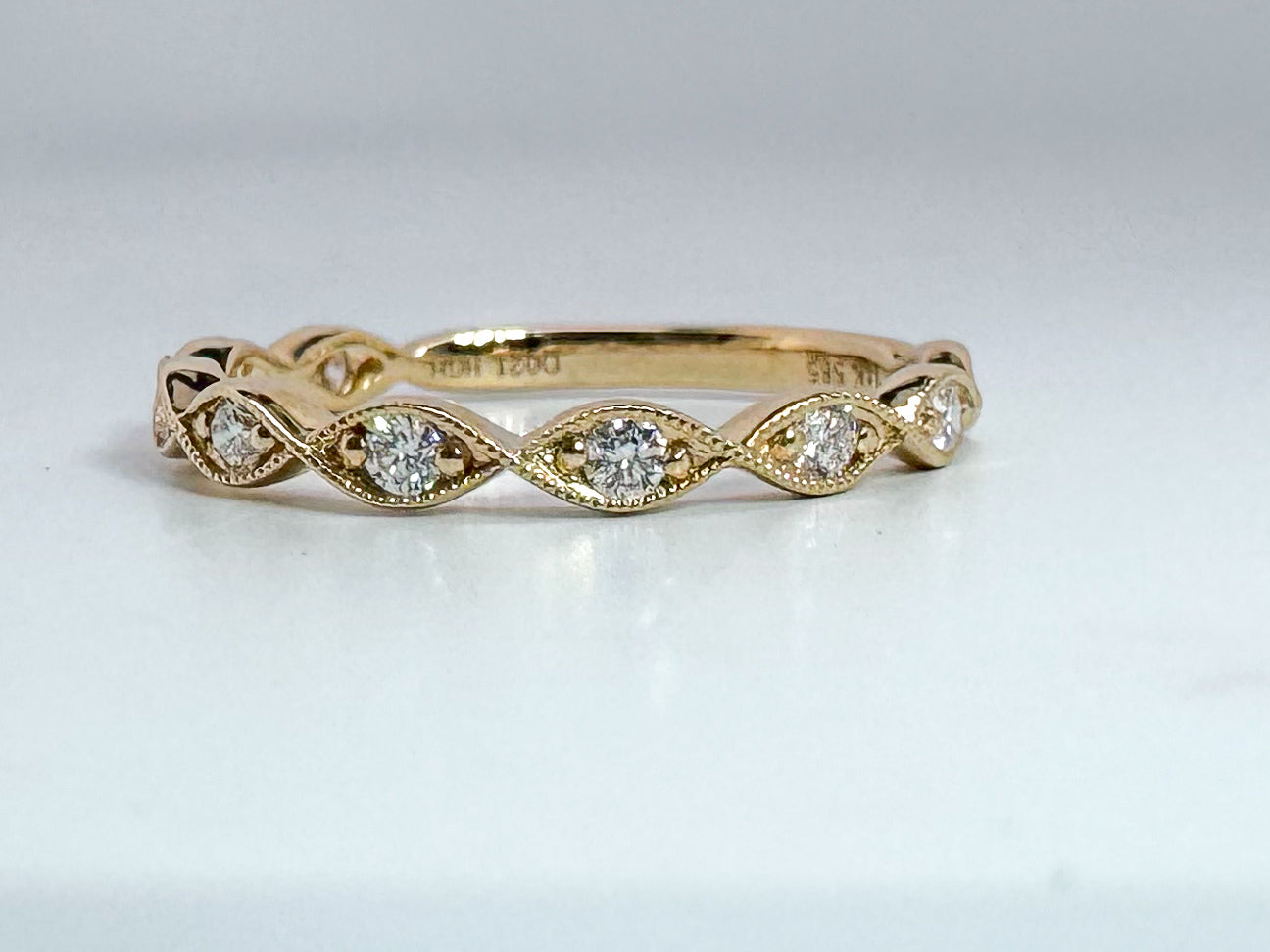 14k, yellow gold scalloped .21 carat, natural diamond band.