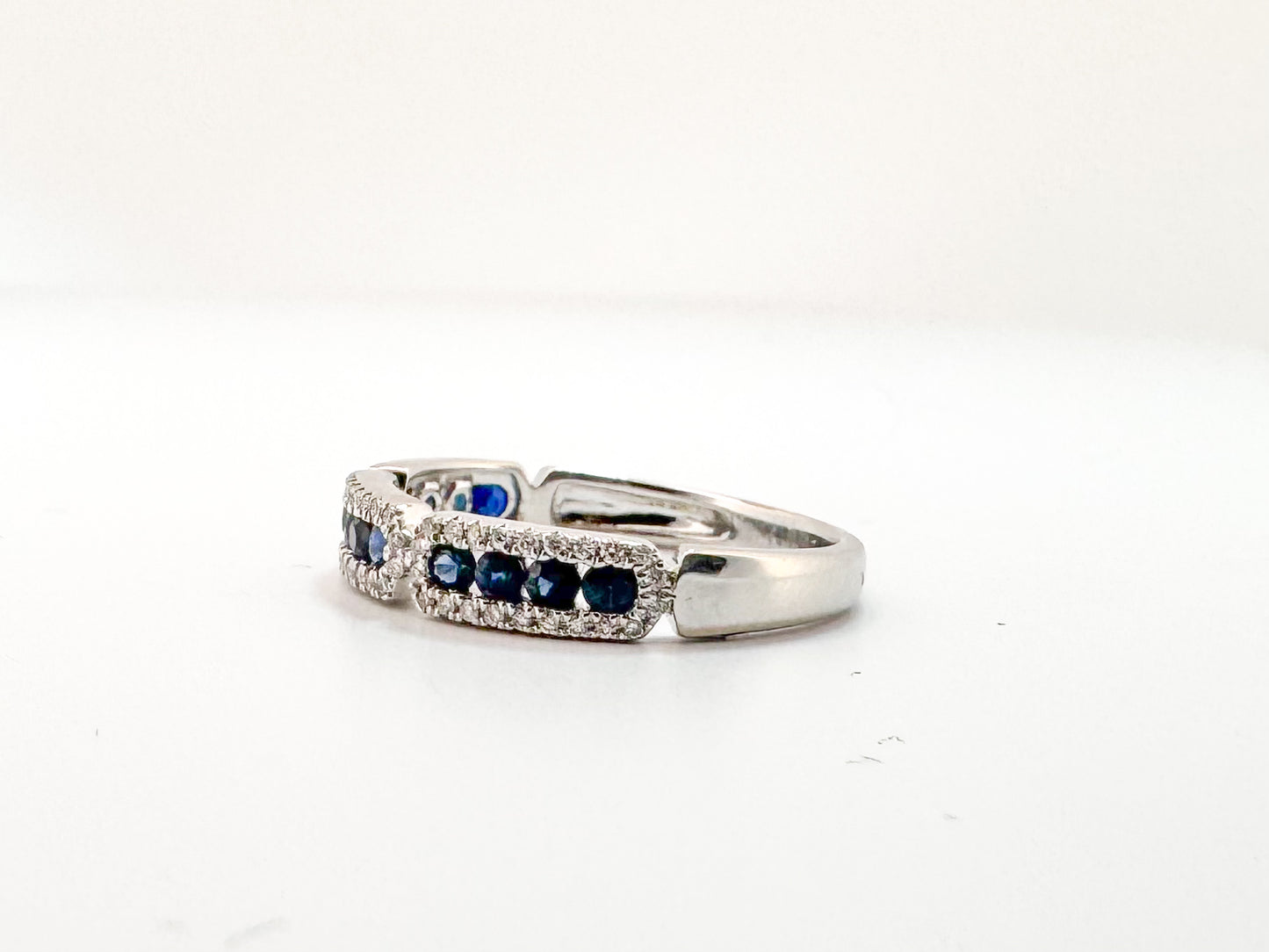 14k, White gold, .20 diamond total weight, .42 sapphire total weight.
