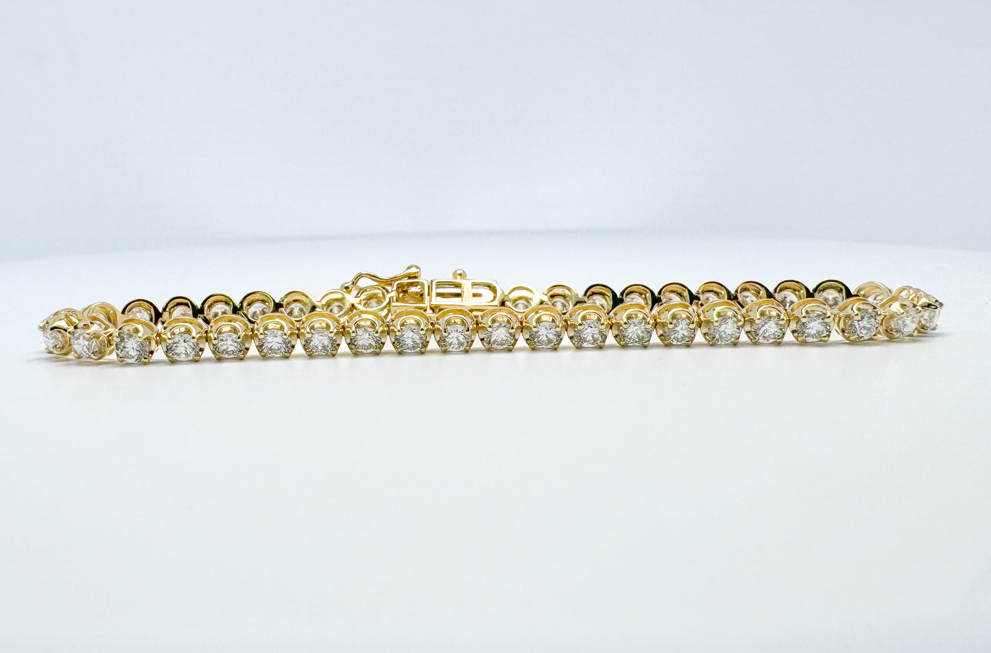 14K, Yellow gold 4.45 carat lab grown diamond tennis bracelet.