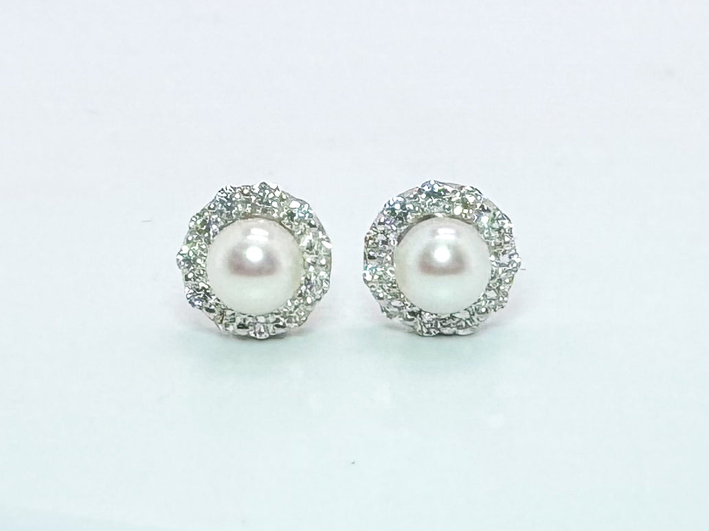 18k, white gold Pearl and diamond stud earring. .50 diamond total weight with 5.5mm pearls.