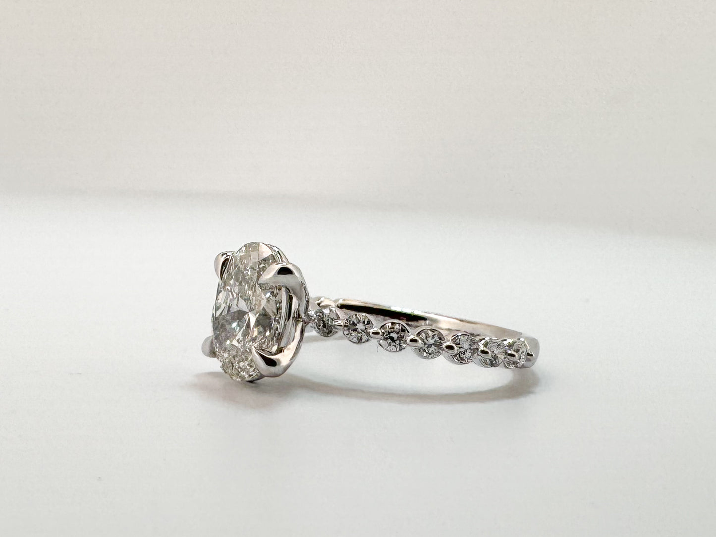 14KW, 1.98 carat lab grown oval, VS1 F, Set with .41 carats of side diamonds IGI certified