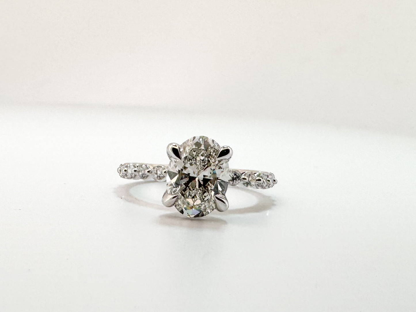 14KW, 1.98 carat lab grown oval, VS1 F, Set with .41 carats of side diamonds IGI certified