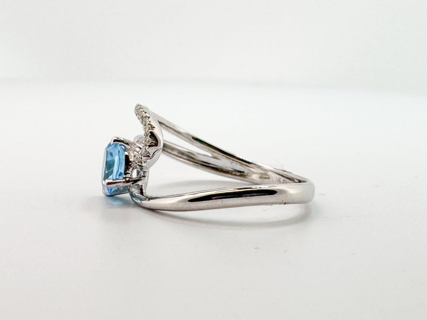 14K, white gold,  1.00 CT Blue topaz with .10 side diamonds fashion ring.