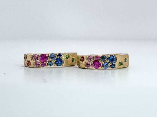 14K,Yellow gold, natural rainbow sapphire huggy earrings. .38 carat total weight.