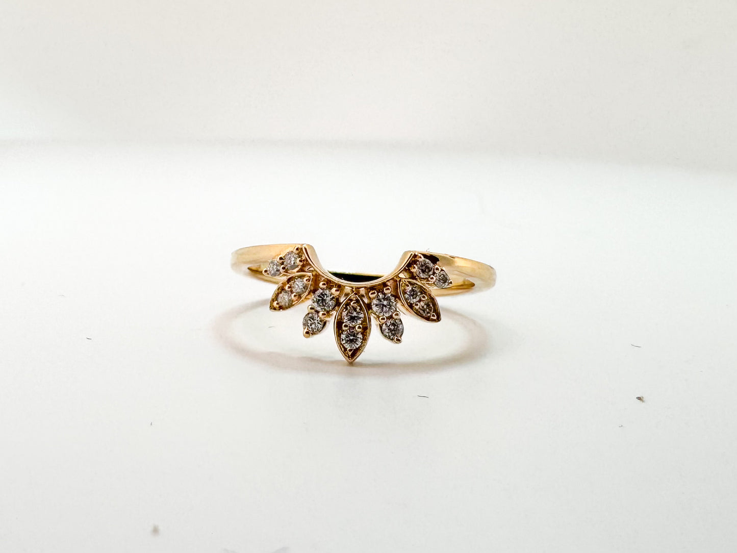 14K, Yellow gold, .16 carat total weight diamond curved band.
