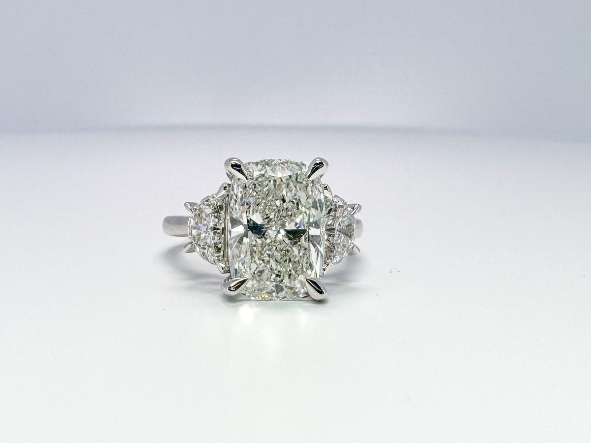 Lab grown 5.09 cushion cut with .90 half moon side diamond engagement ring.
