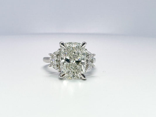 Lab grown 5.09 cushion cut with .90 half moon side diamond engagement ring.