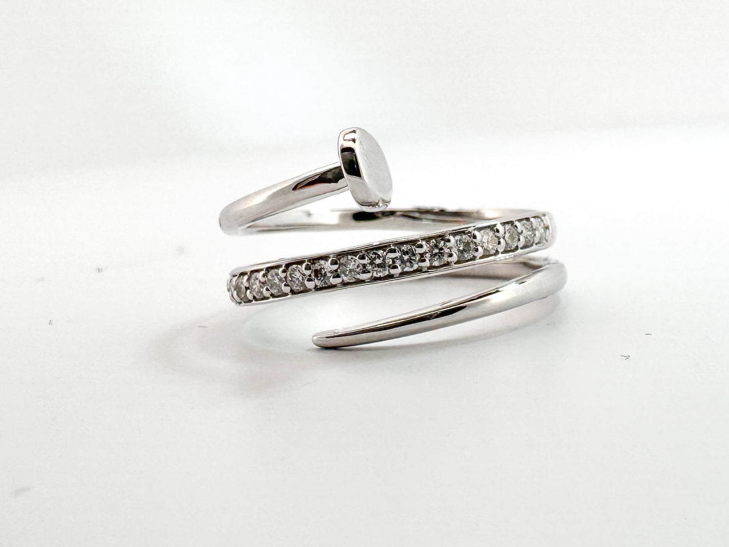 14K, white gold, diamond nail ring. .20 carat total diamond weight.