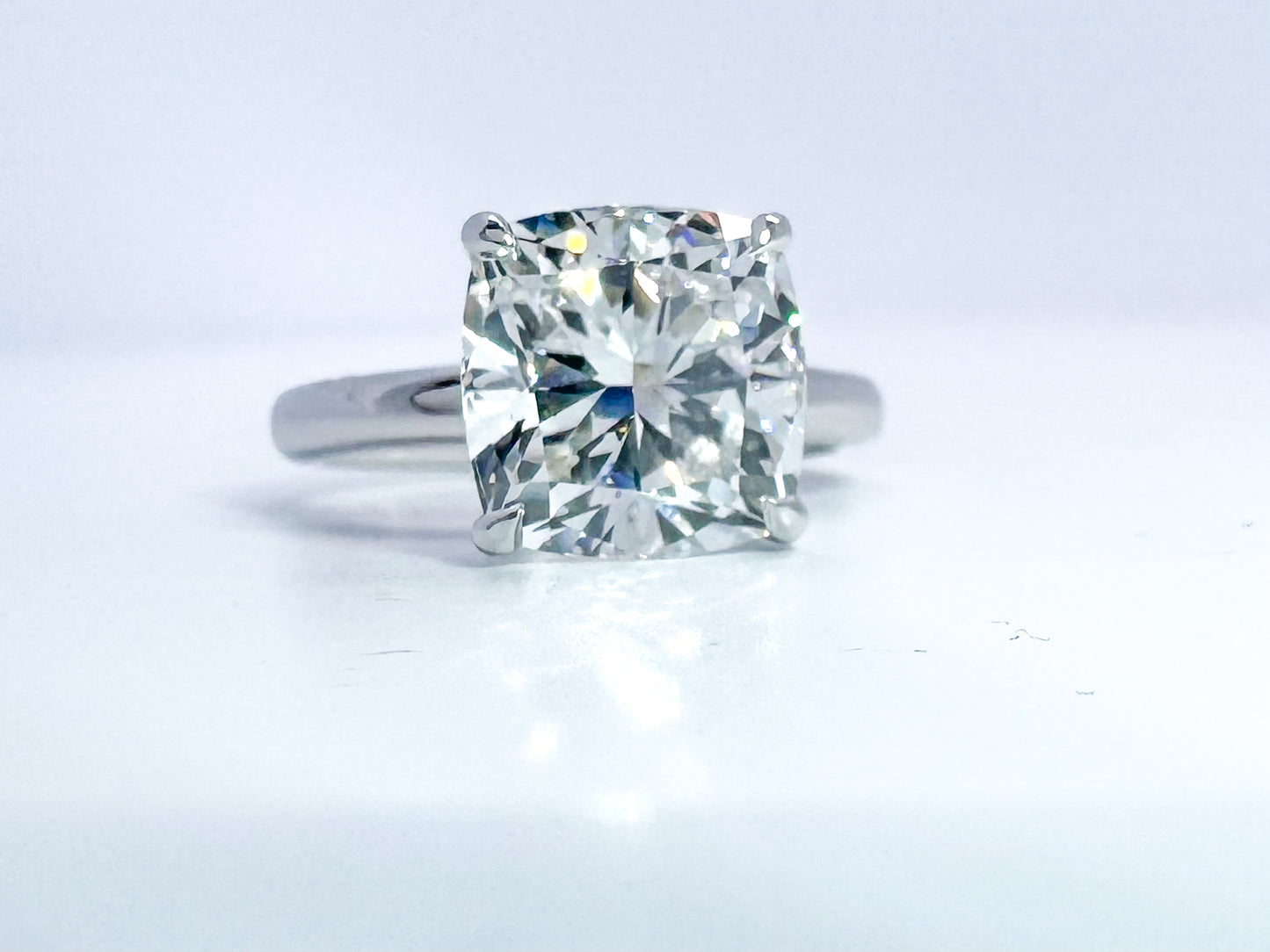 14k, White gold, 5.02 lab grown cushion cut diamond set in solitaire. IGI certified