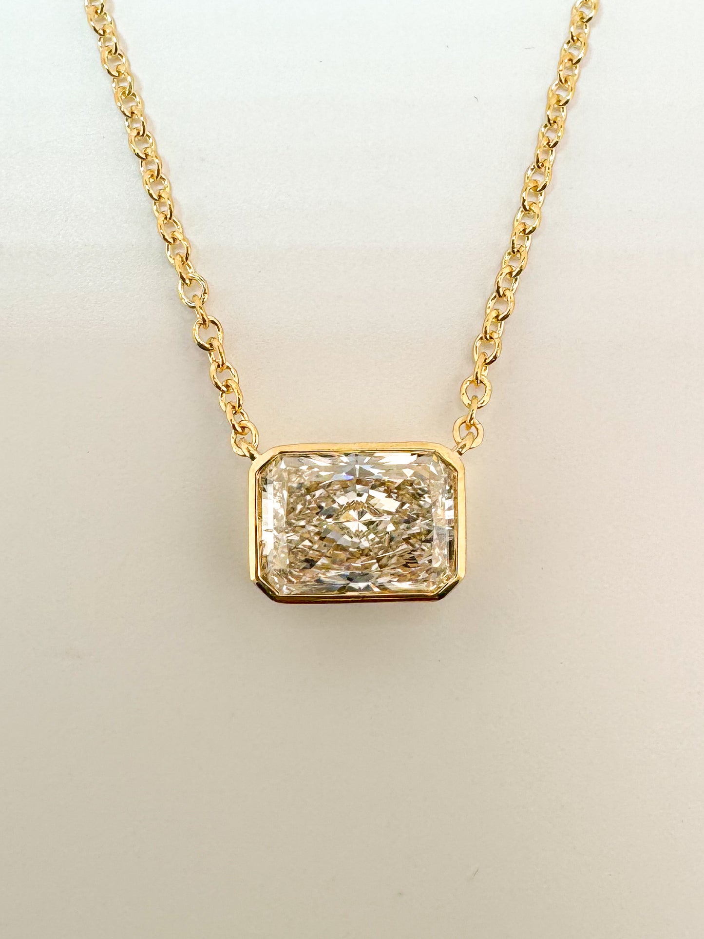 14K, yellow gold 2.15 VS1 E Radiant cut diamond solitaire necklace. IGI certified