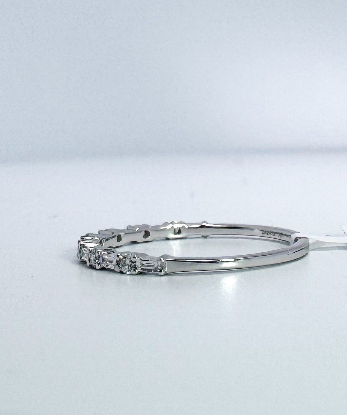 14k, White gold .20 dtw baguette and round brilliant diamond wedding band.