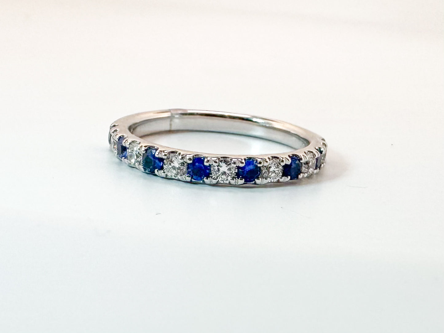 14k, White gold , sapphire and diamond band. .24 ctw diamond/ .48 ctw sapphire