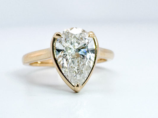 14K, Yellow gold 2.01 VS1 F pear shaped lab grown diamond with .10 side diamonds. IGI certified