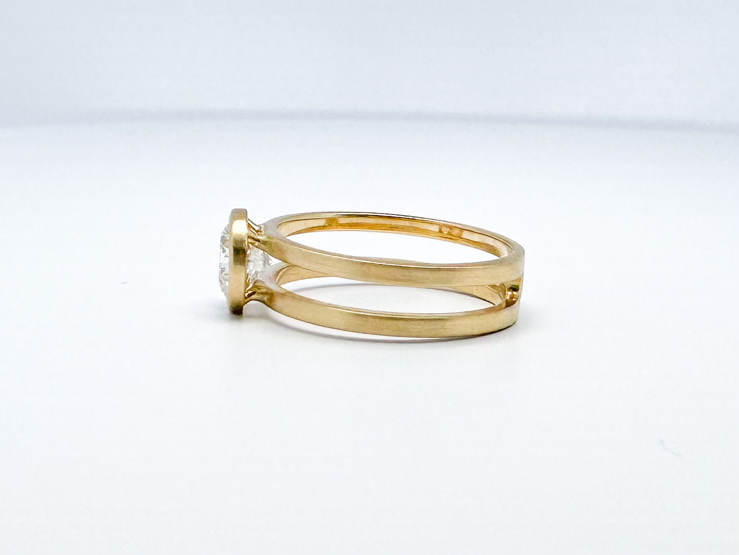 14k yellow gold split shank diamond ring with satin finish.