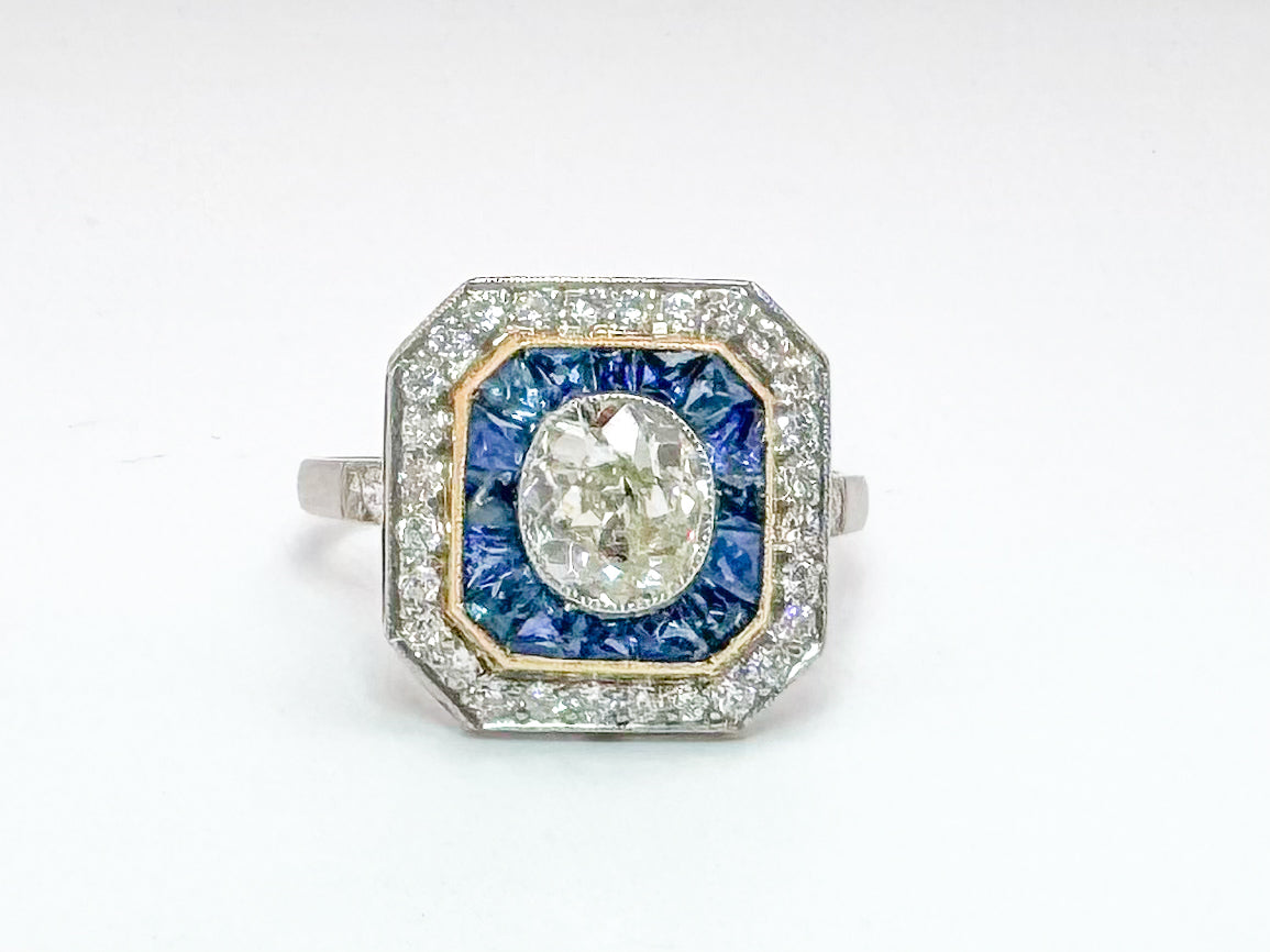 Platinum & 18k vintage 1.00 carat center old mine cushoin cut with 1.90 natural sapphire and .40 ct side diamonds