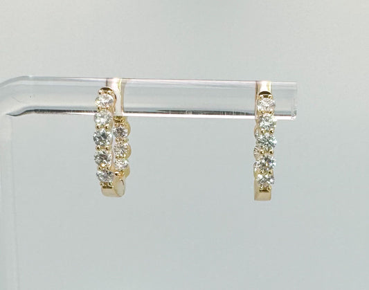 14K yellow gold .64 diamond total weight inside out lab grown diamond huggie style earrings.