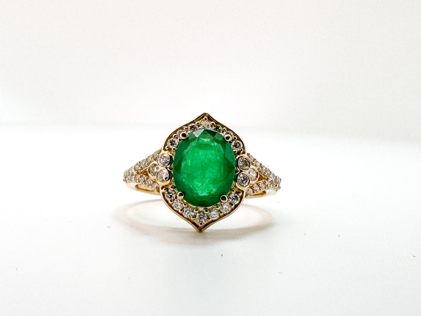 14K, yellow gold, 1.75 carat natural emerald, set with .40 carats of natural side diamonds.