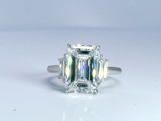 5.02 carat  Natural Emerald cut SI1 D Flanked with (2) step cut trapezoids =.36 carats