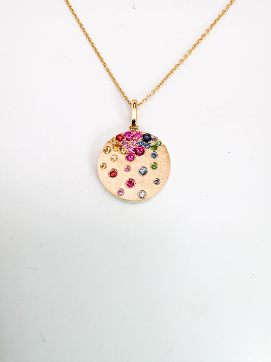 14K,Yellow gold, rainbow sapphire, ruby and tsavorite garnet sparkle penant and chain.