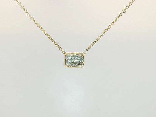 14k, yellow gold .92 sideways lab grown radiant cut, bezel set pendant.