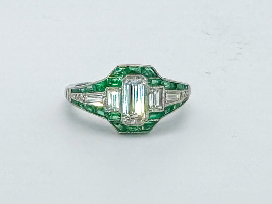 VINTAGE, Platinum .58 Natural emerald cut diamond set with .38 side diamonds and Natural Emeralds