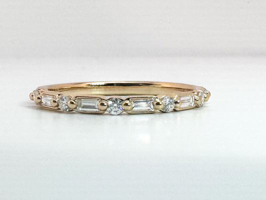 14k, yellow gold, baguette and round brilliant diamond wedding band. .25 carat total weight.