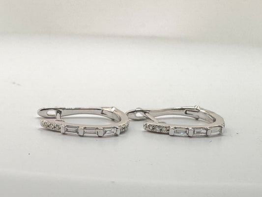 14k, white gold, round brilliant and baguette diamond hoop earrings.