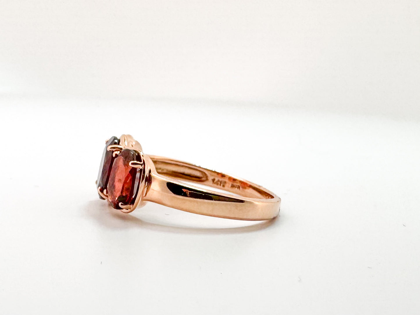 14K, Rose gold, three stone garnet ring. 3.25 carats