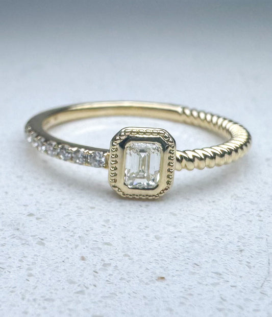 14k yellow gold, Emerald cut and round brilliant diamond fashion ring with .28 ctw