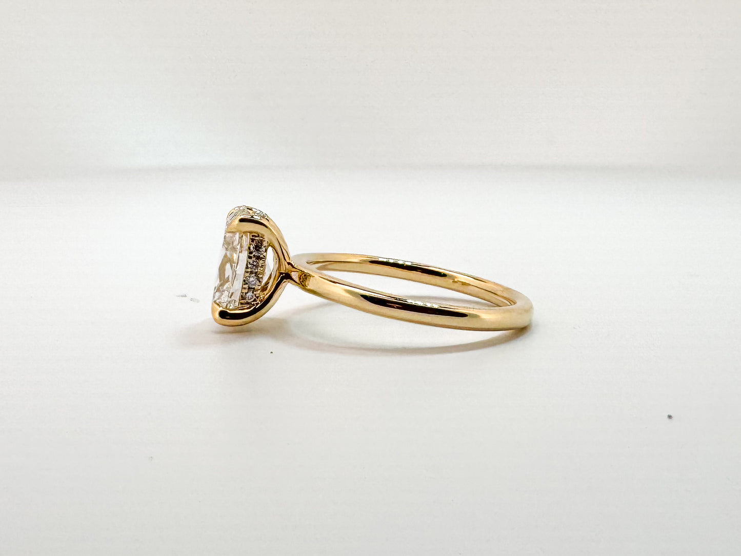 14k, Yellow gold 1.93 carat oval set with .07 dtw hidden halo.