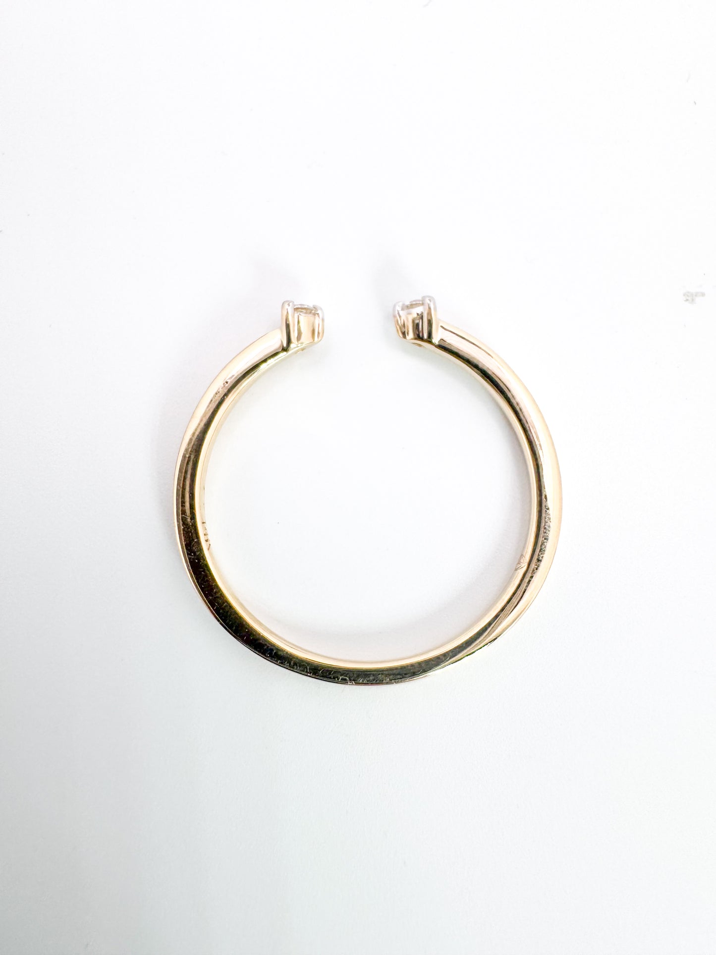 14K, Yellow gold, two diamond, open concept band. .05 carat total weight.