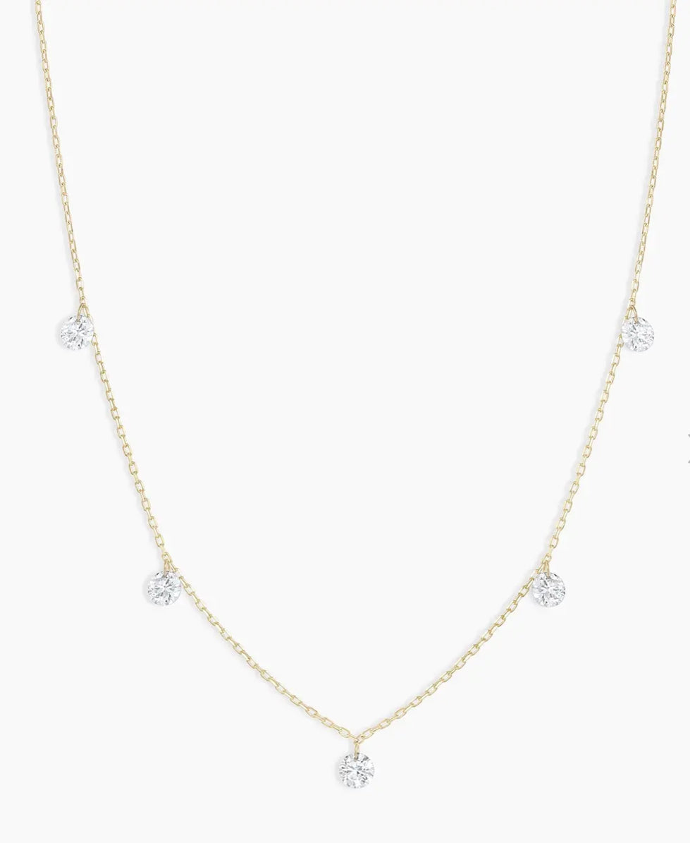 14K,yellow gold (5) floating diamond necklace. .35 natural diamond total weight