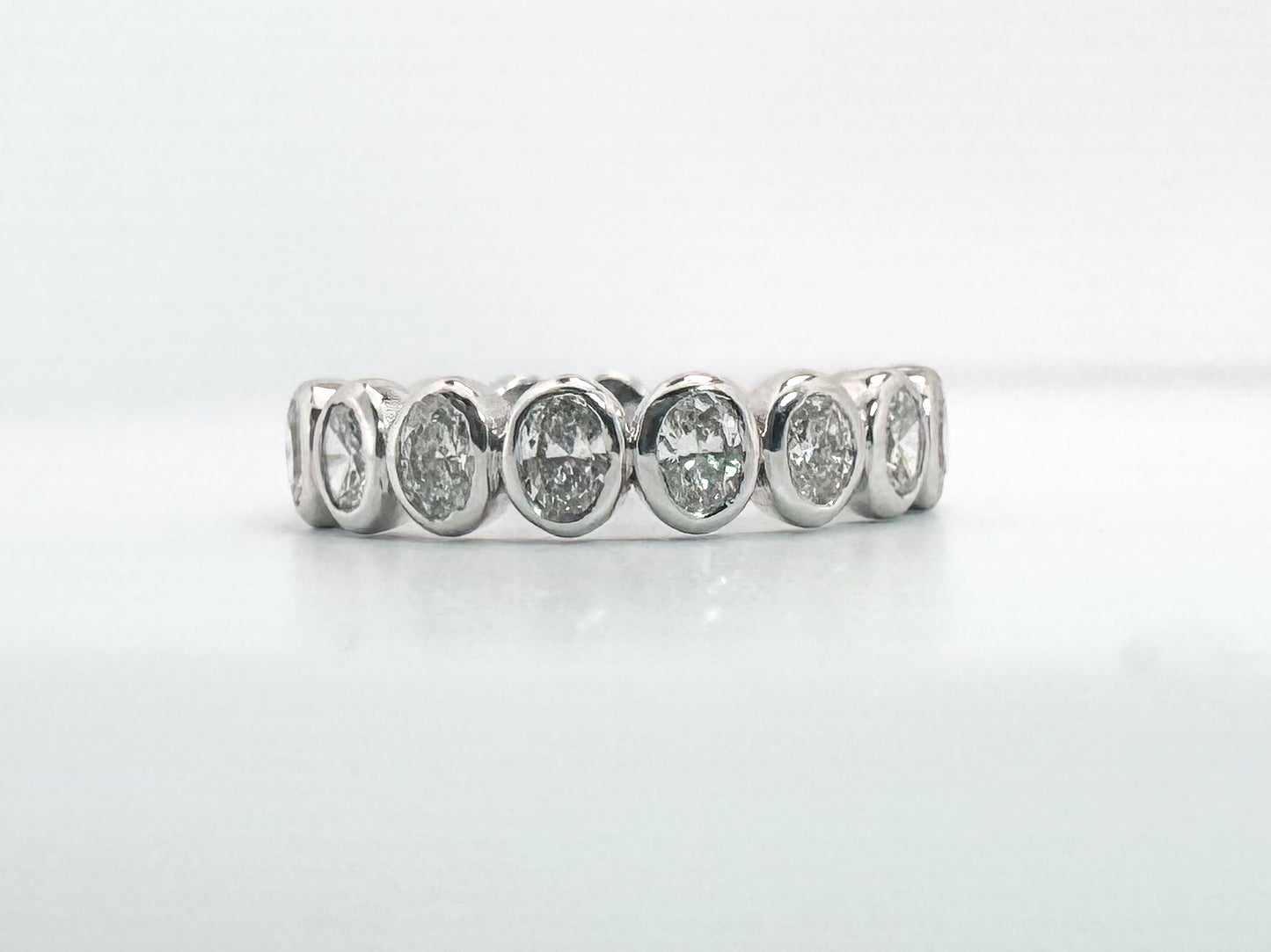14k, white gold, natural oval diamond band. .97 carats