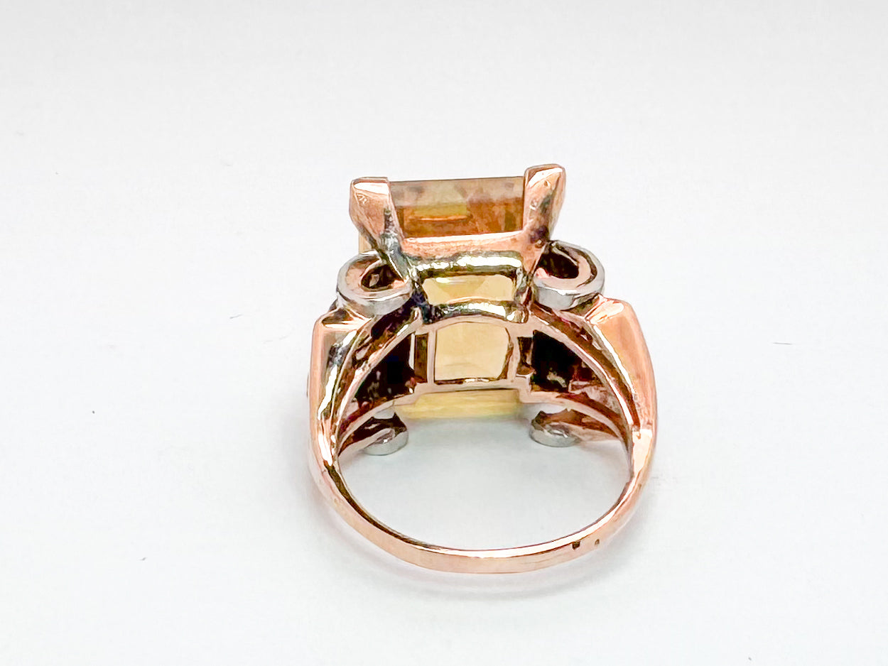 Platinum & 18k, Rose gold retro ring. 12.0 carat citrine, with .32 dtw flanked with syn ruby.