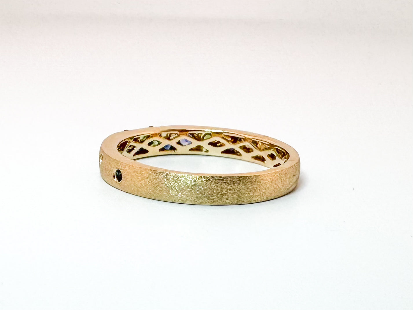 14K, Yellow gold, sapphire and tsavorite garnet fashion band. .37 carat total weight.