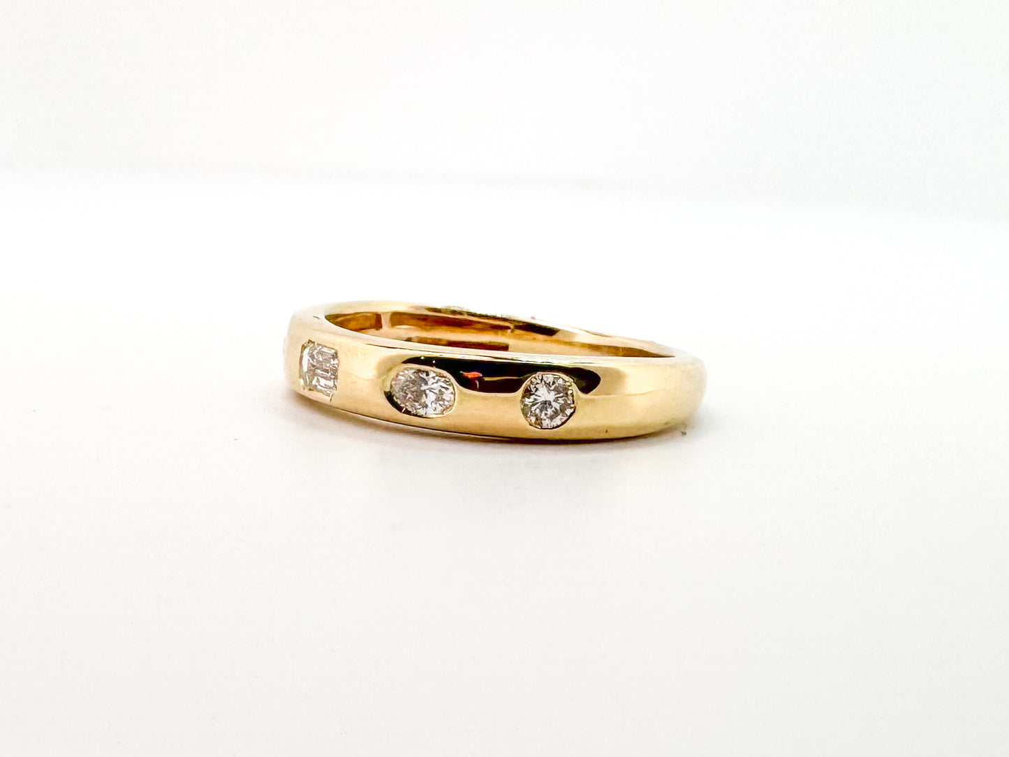 14k, Yellow gold, flush set, multi diamond shape band. .50 diamond total weight.