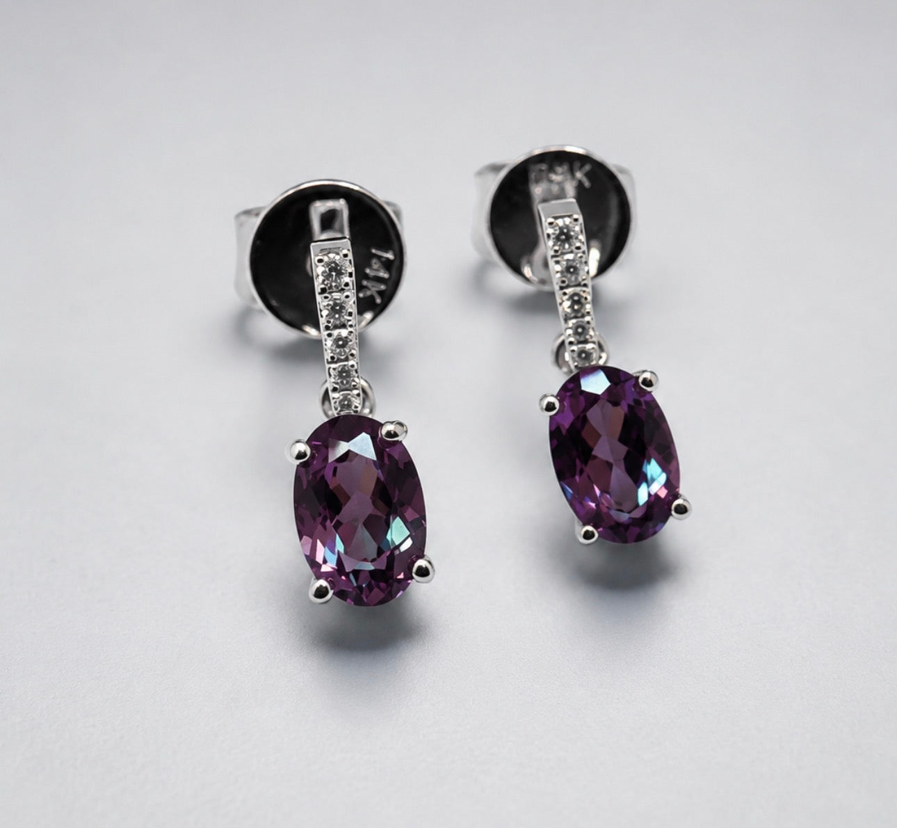 14k, White gold, .06 diamond total weight, created Alexandrite drop earrings.