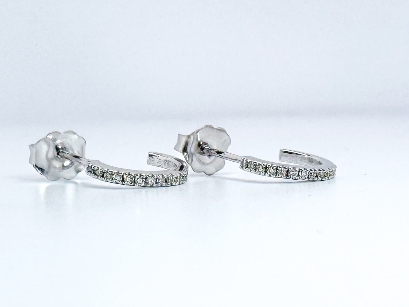 14K, white gold, .10 DTW natural diamond huggie hoop earrings.