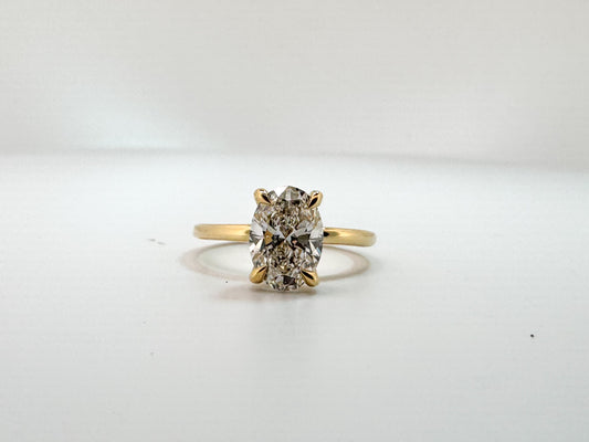 14k, Yellow gold 1.93 carat oval set with .07 dtw hidden halo.