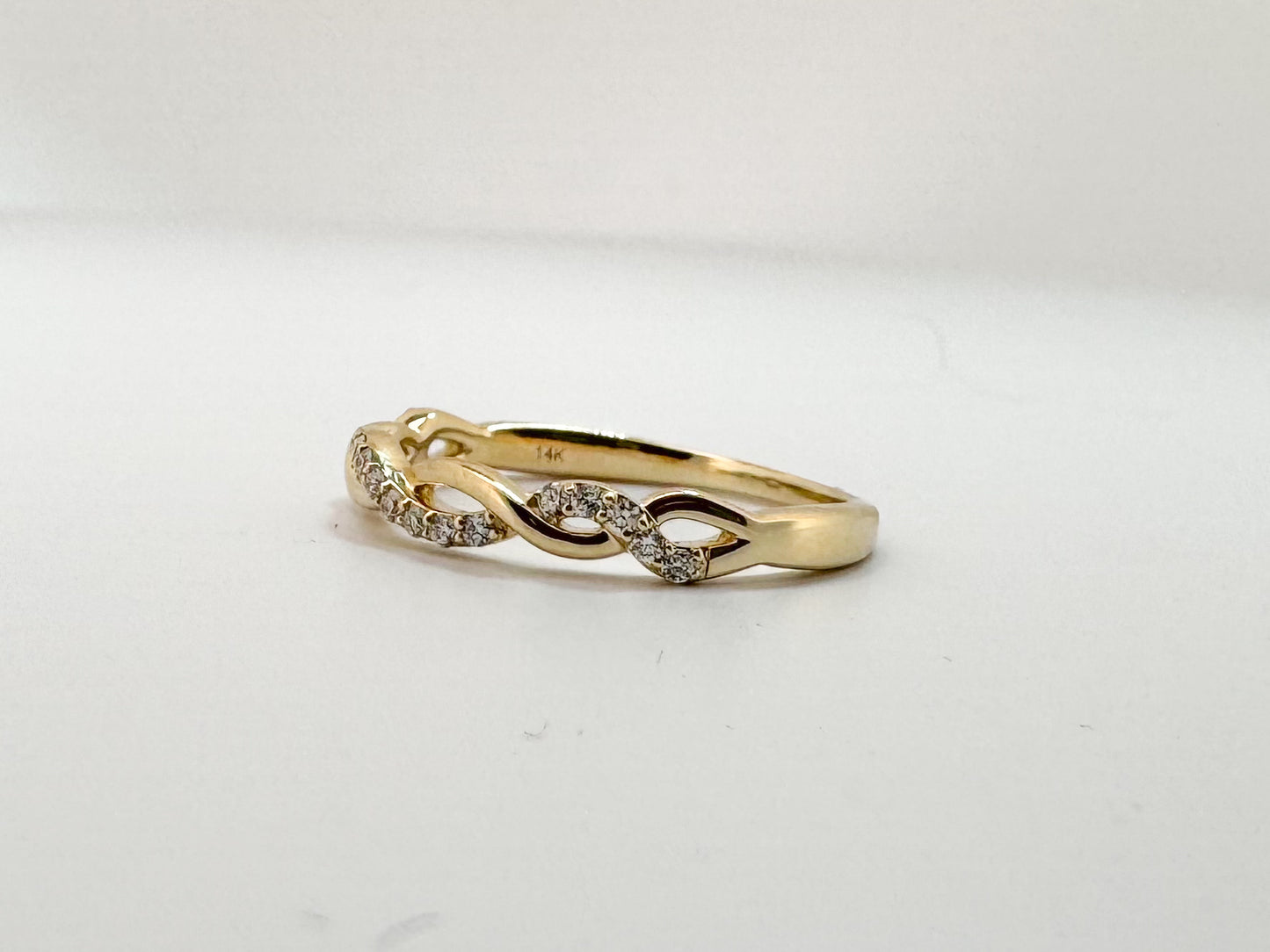 14K, Yellow gold, .14 diamond total weight, twisted wedding band.